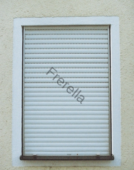 white window blinds on white concrete wall