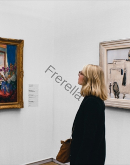 woman looking at painting