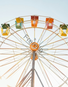 worm's eye view of red, orange, and yellow Ferris wheel