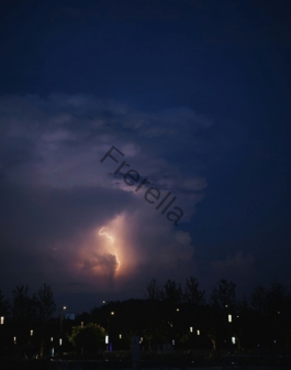 A dark sky with a lightning bolt in the distance