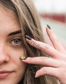woman with yellow and black ring on her left eye