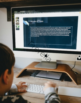 silver imac on brown wooden desk