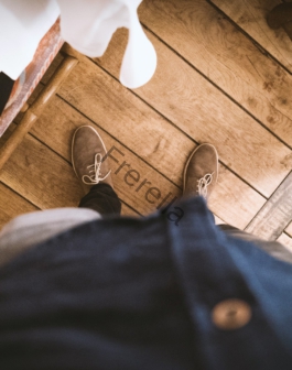 person standing showing brown sneakers