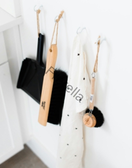 three black and brown bathroom cleaning tools