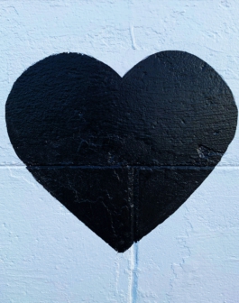 black heart printed concrete wall