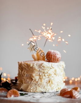 cake with lit sparkling stick