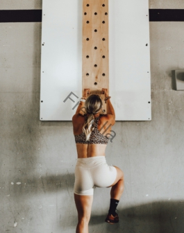 a woman holding a wooden pole
